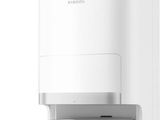 a close up of a white water dispenser on a white surface