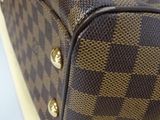 an image of a louis vuitton bag on a table