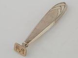a close up of a silver spoon with a number on it