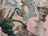 the back of a woman ' s dress with flowers on it