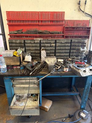 a workbench with a lot of tools on top of it