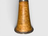 an old brass bell that is sitting on a table