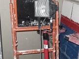 a ladder with a camera on top of it in a room