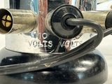 a silver and black electric device on a table