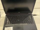 a laptop computer that is sitting on a table
