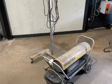 a machine that is sitting on the floor in the garage