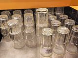 a lot of empty glasses sitting on a table