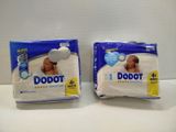 two packs of baby diapers sitting next to each other on a table