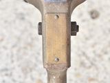 a close up of a parking meter on a sidewalk
