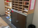 a desk with a bunch of papers on it in a room