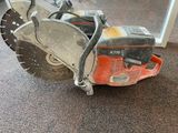 a chainsaw that is sitting on the floor in front of a window