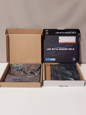 two boxes with a pair of scissors in them on a table