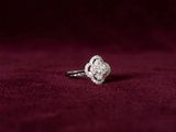 an image of a diamond ring on a red velvet background