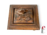 a picture of a wooden box with a bird on it