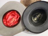 two hats sitting next to each other on a table