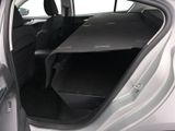 a car with its back door open and a table in the trunk