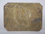 an image of a metal plaque with a bird on it