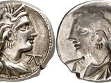 a silver coin with an image of a man and a woman on it