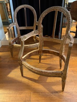 two chairs that are sitting on a wooden floor