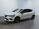 a white car in a white room with a black floor