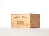 a wooden box with a drawing of a building on it