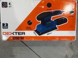 an orange box with a blue and black sander in it