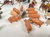 a lot of toy figurines that are on a table