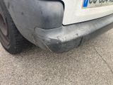 a close up of a car ' s bumper with a number plate on it