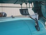 a blue truck with a camera attached to it ' s hood