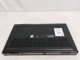 a laptop that is sitting on a white surface