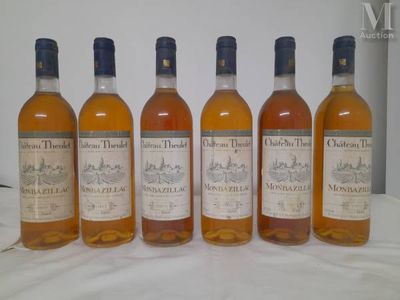 six bottles of whiskey lined up on a table
