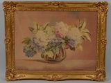 tableau représentant un vase de fleurs dans un cadre doré posé sur une table