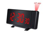 a black alarm clock with red numbers on a white background