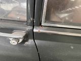 a close up of a car door handle with a key in it