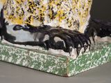 a close up of a statue of a bird on a table