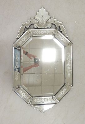 a person taking a picture of themselves in a mirror