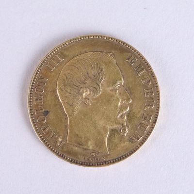 a gold coin with a picture of a woman on it