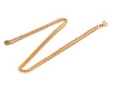 a gold chain necklace on a white background