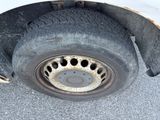 a close up of a flat tire on a truck
