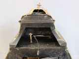 an old wooden clock with a clock face on it