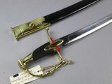 two swords that are on display on a table