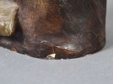a close up of a statue of a bear on a table