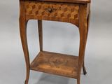 an old wooden table with a drawer on top of it