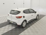 a picture of a white car parked in a garage