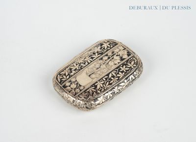 an antique silver pill case with a picture of a woman on it