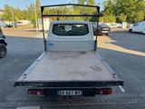 a white pick up truck parked in a parking lot