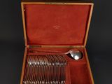 a wooden box with a set of silverware in it