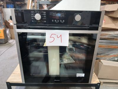 a black and silver oven with a price tag on it