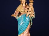 a statue of the person holding a child in her arms