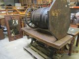 a large wooden barrel sitting on top of a wooden table